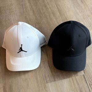 Two (2) Jordan Golf Hats Black and White Caps
